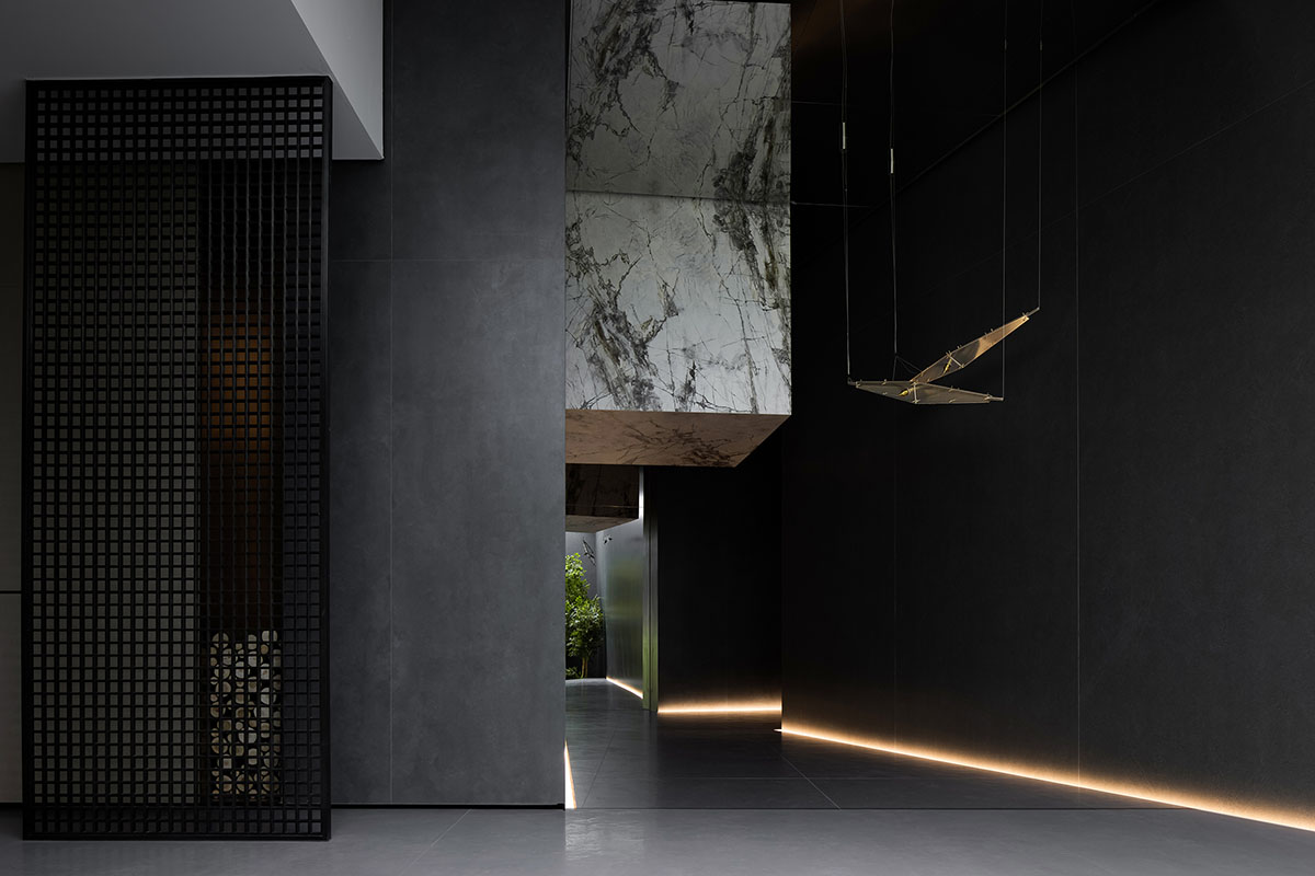 Exhibition hall interiors feature sharp angles and surfaces addressing diamond cutting processes