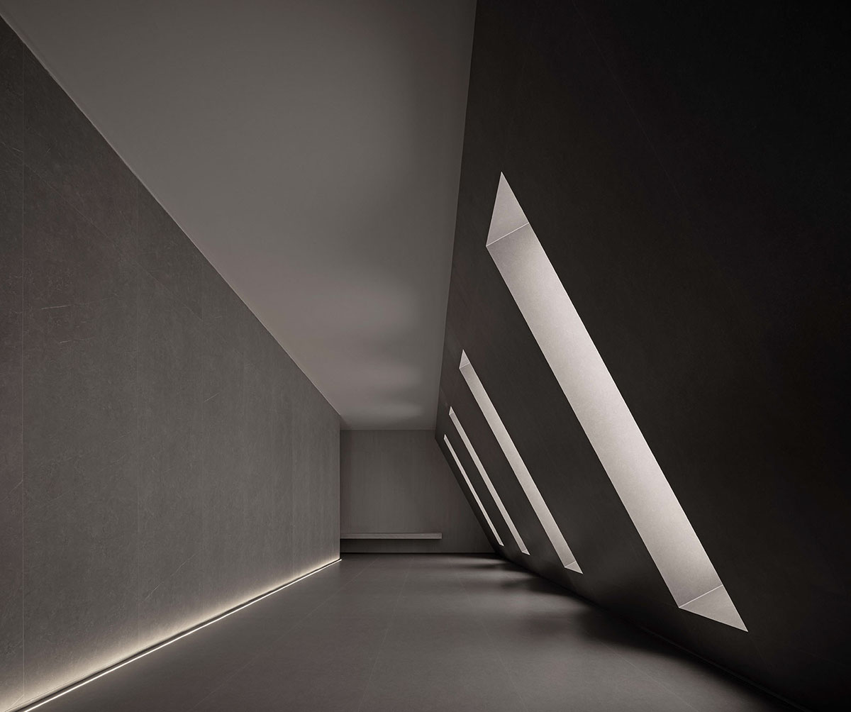 AD ARCHITECTURE creates dark interiors for showroom playing with light and sharp geometries in Foshan