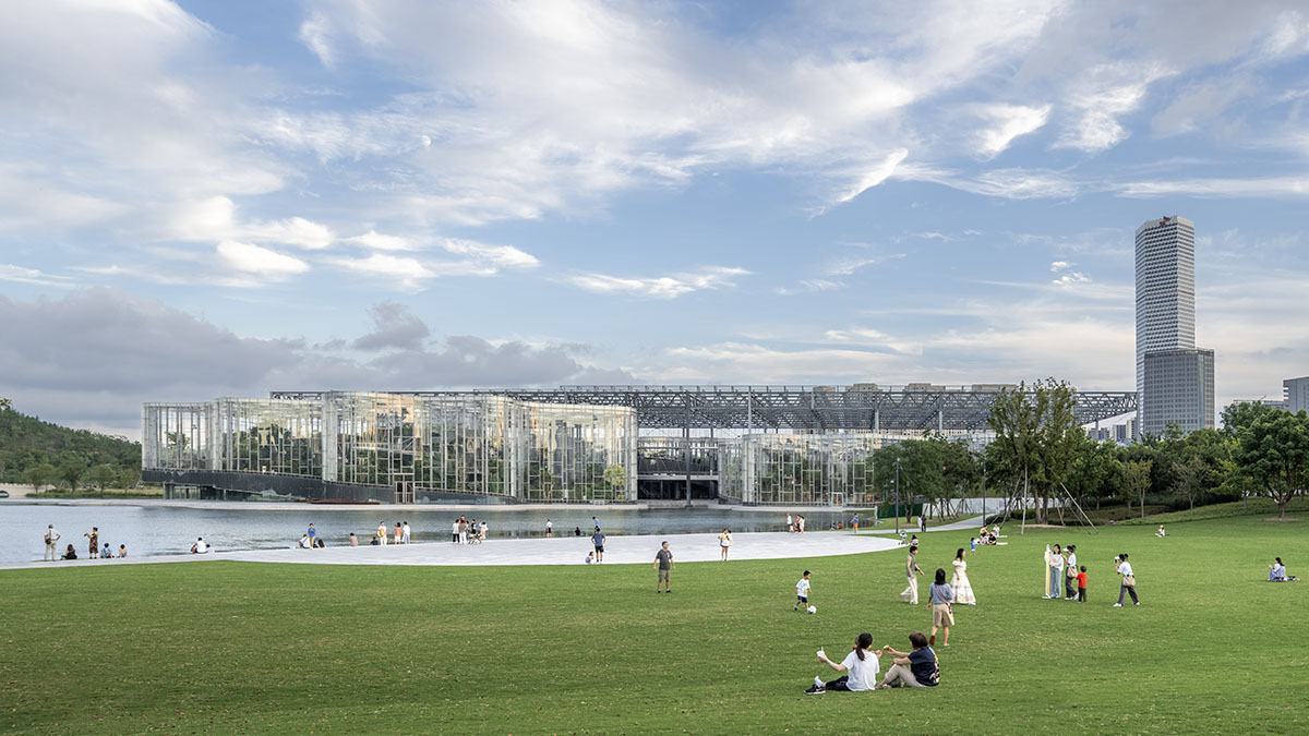 The former steelworks of a power plant are integrated with organically-shaped greenhouse pavilions