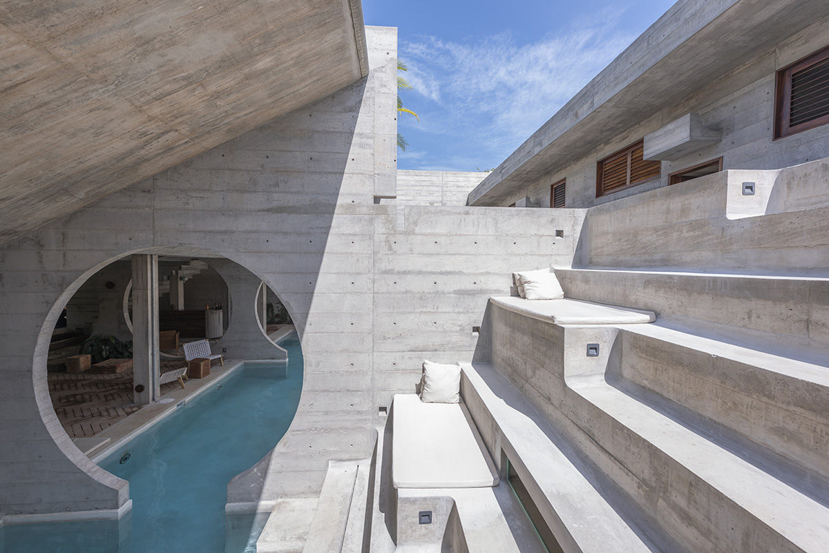 Casa TO by Ludwig Godefroy features an island of stairs and vaulted volumes to create discreet oasis