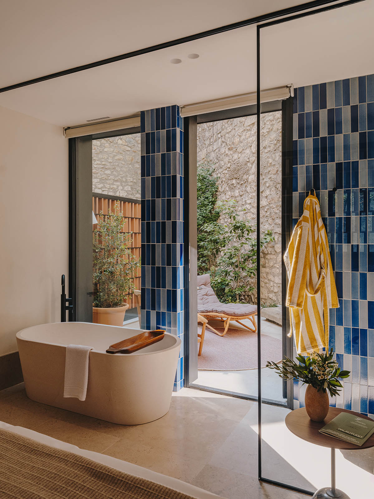 El Equipo Creativo converts 18th-century palace into hotel with rich textures and colors in Girona