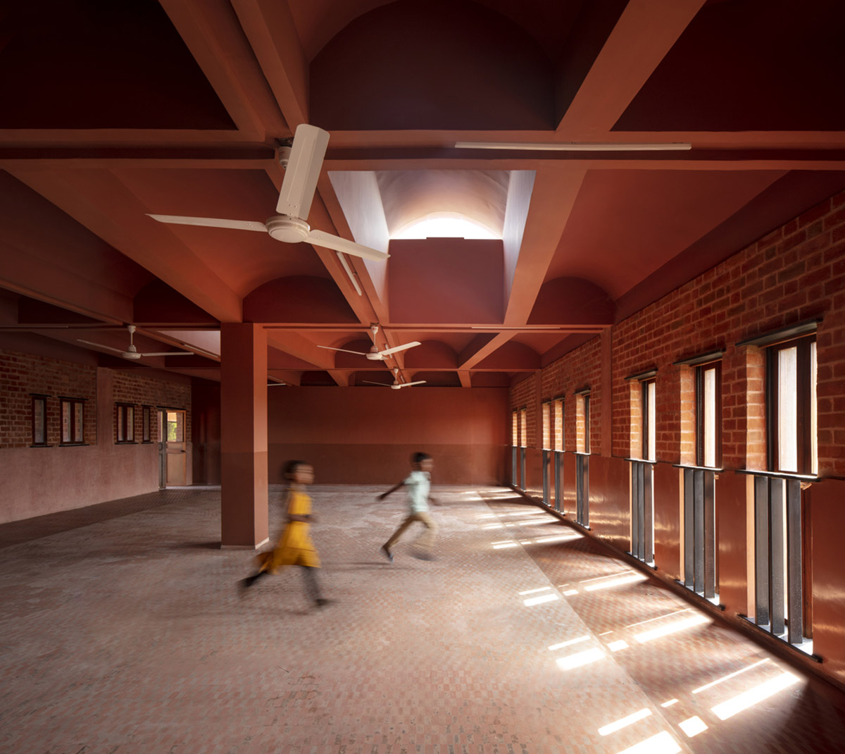 A school built from tilted brick vaults evoke a child's freedom in India