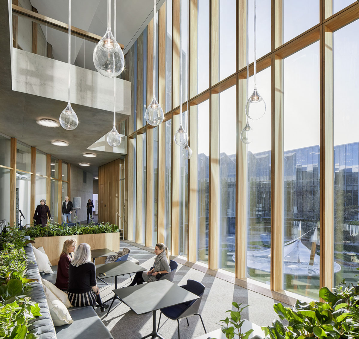 Herzog & de Meuron creates glass disc with saw-tooth roof for new AstraZeneca research centre