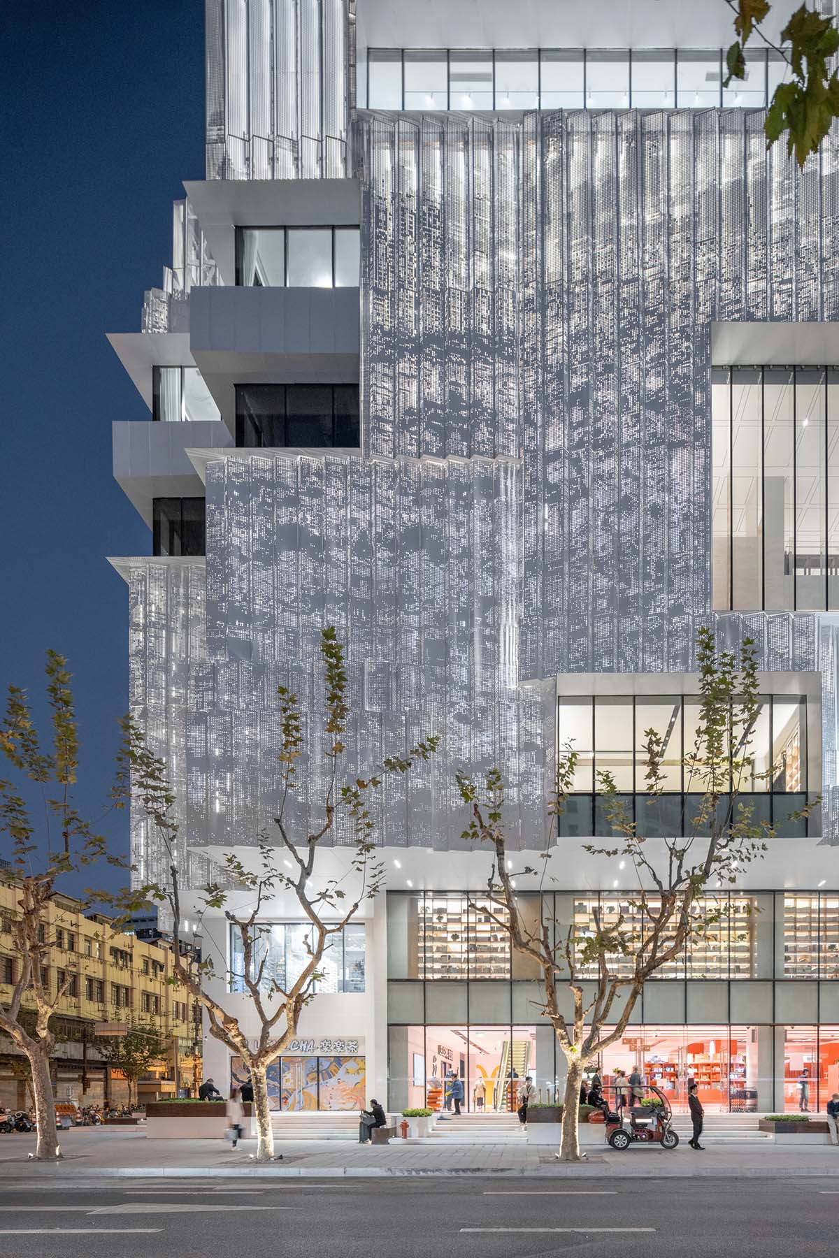 Shanghai Book City by Wutopia Lab clad in perforated metal panels giving a dazzling effect