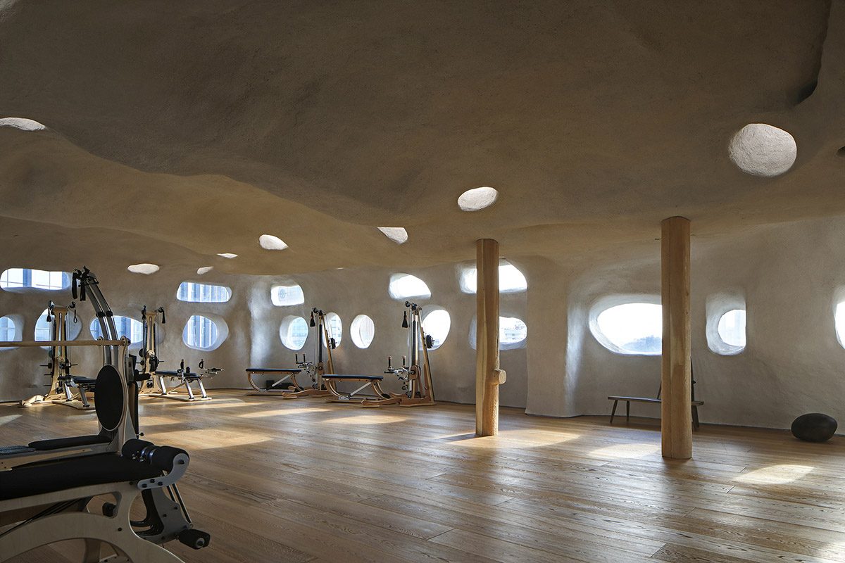 Pilates studio by Wanmu Shazi creates cave-like experience with amorphous interiors in Xiamen
