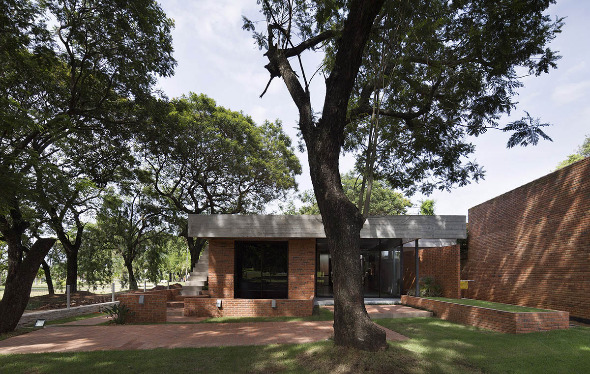 Concrete roof slabs and surfaces freely fly over this brick house in ...