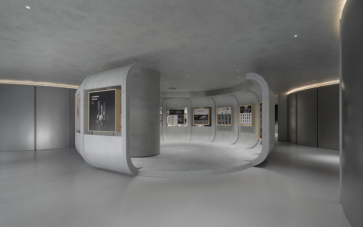 E Studio takes visitors into space travel with a flow of sculpted stainless steel for a showroom