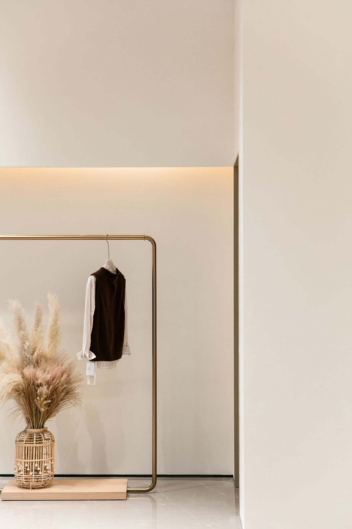 JYDP designs retail space with warm tones and curved walls in Shanghai