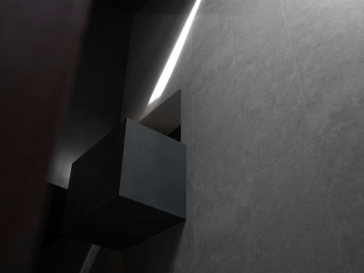 AD ARCHITECTURE creates dark interiors for showroom playing with light ...