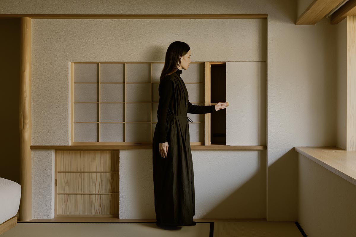 kooo architects creates a wooden interior sanctuary for contemporary accommodation in Kyoto City