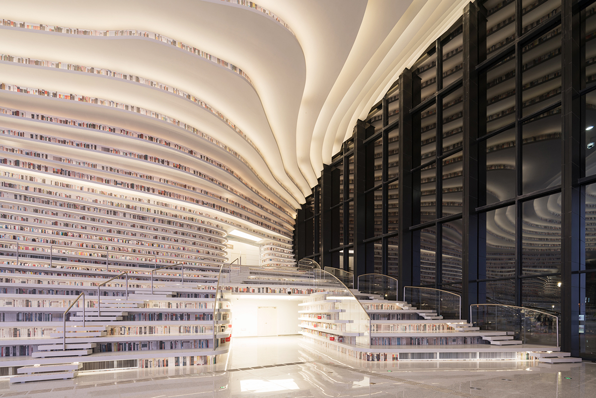 MVRDV’s topographical Tianjin Binhai Public Library featuring millions of books opens in China