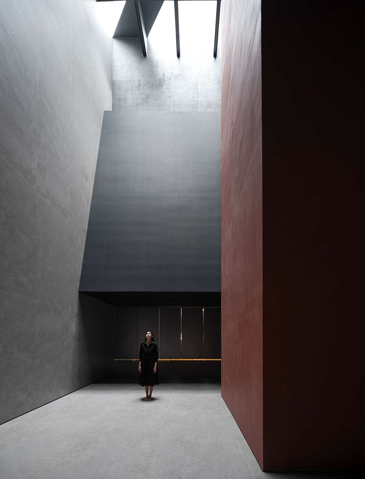 AD ARCHITECTURE creates dark interiors for showroom playing with light and sharp geometries in Foshan