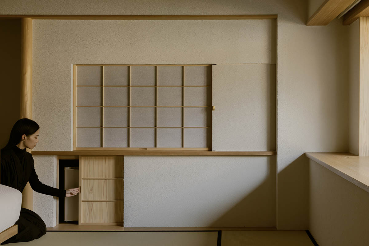 kooo architects creates a wooden interior sanctuary for contemporary accommodation in Kyoto City