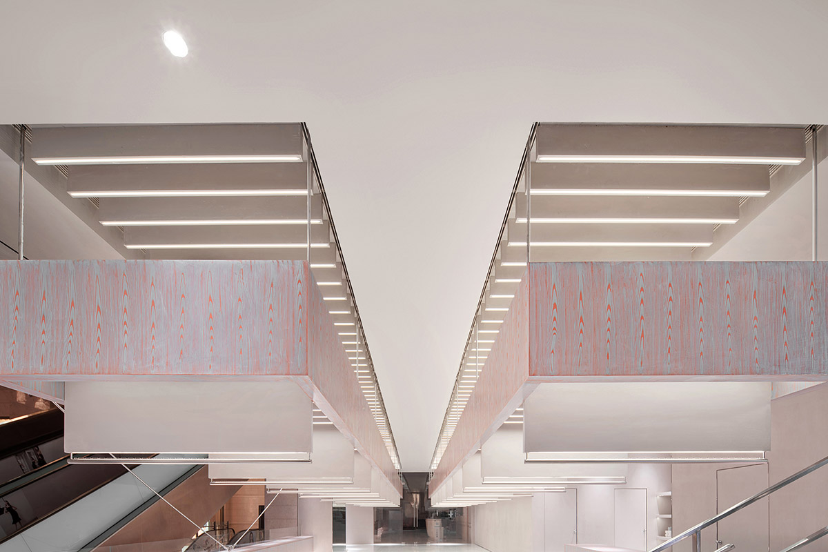Various Associates creates show-like and pink-hued fashion store under a viaduct in Chongqing