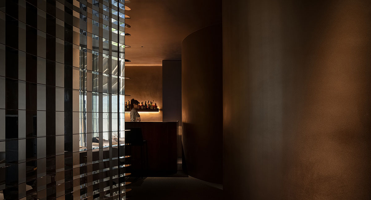 AD ARCHITECTURE designs restaurant with dark and cozy interiors in Shenzhen