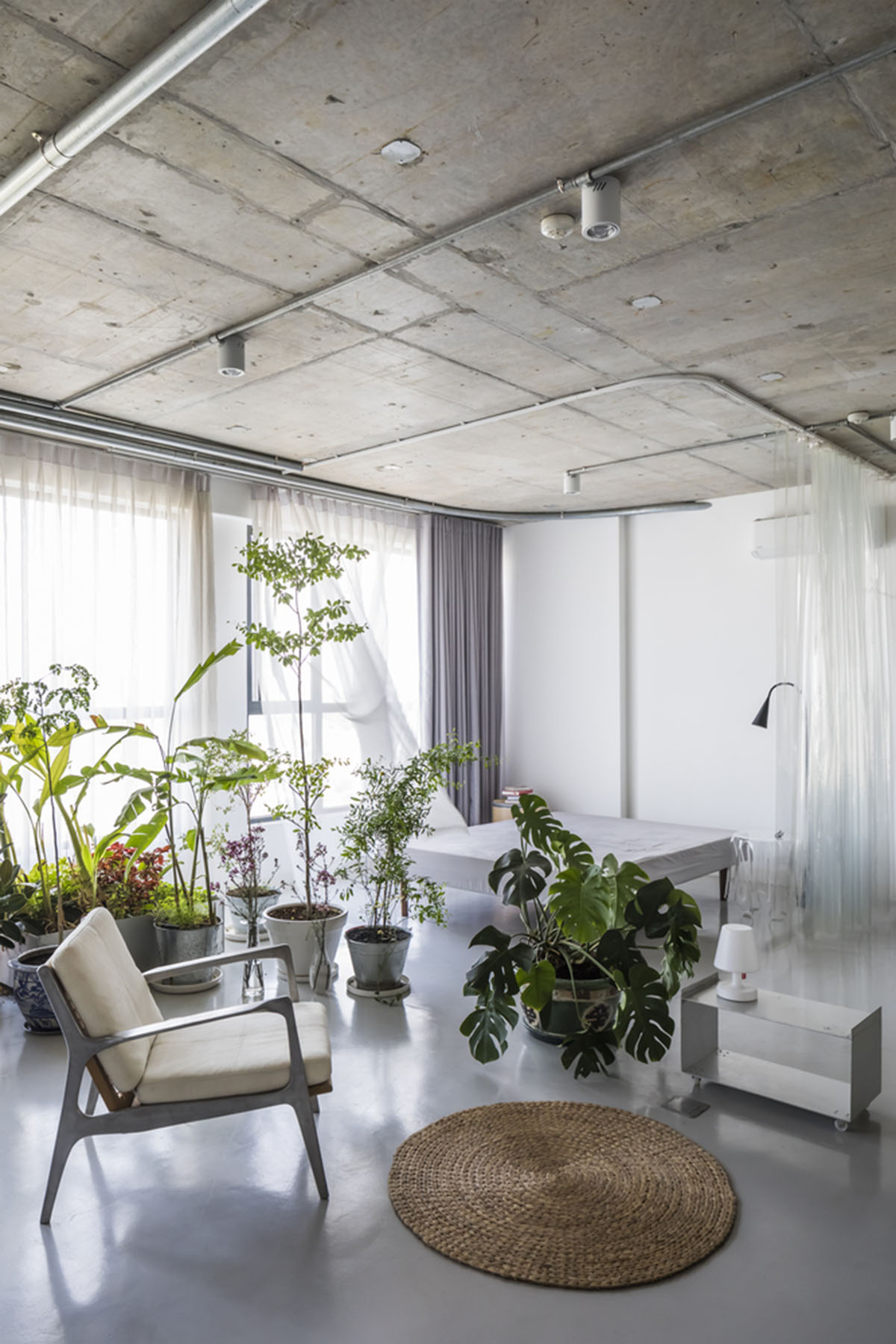 Nhabe Scholae creates landscape-like interior with translucent curtains inside an apartment