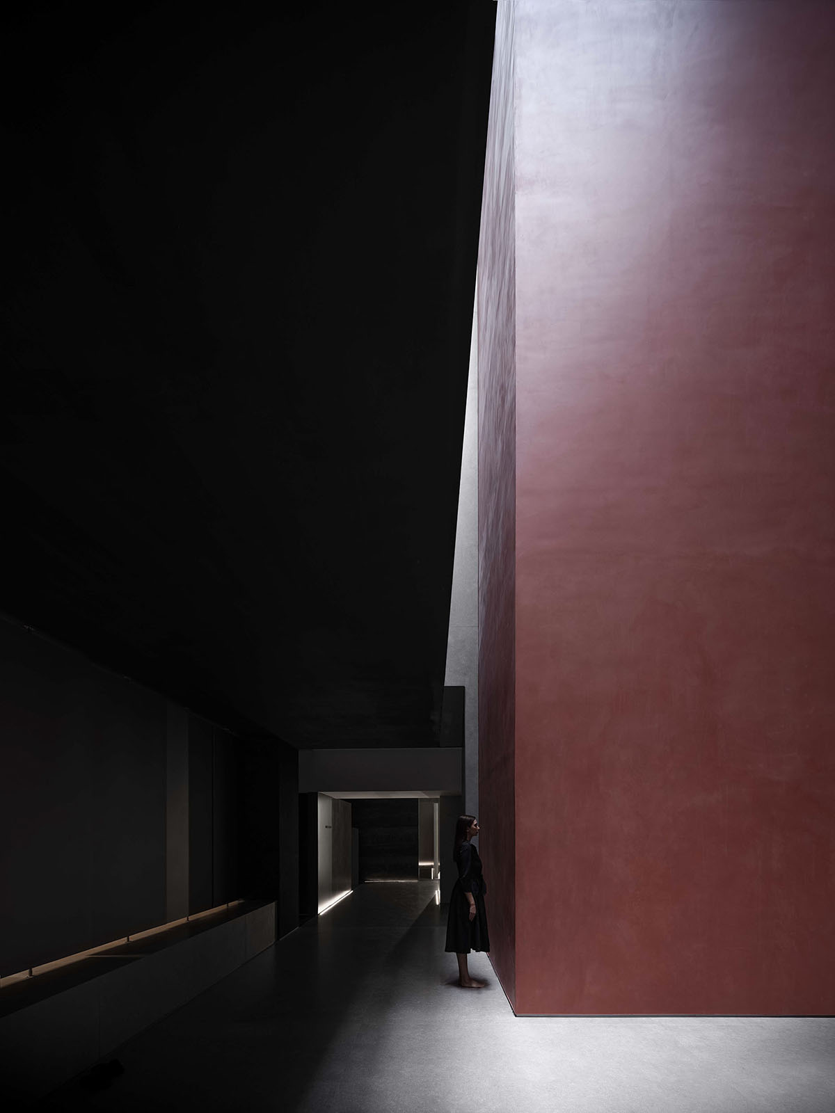 AD ARCHITECTURE creates dark interiors for showroom playing with light and sharp geometries in Foshan