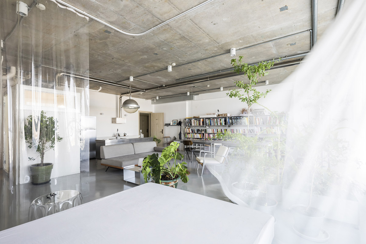 Nhabe Scholae creates landscape-like interior with translucent curtains inside an apartment