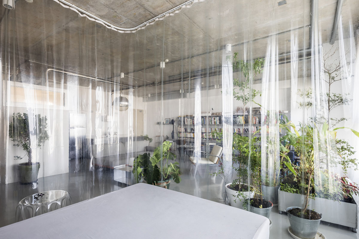 Nhabe Scholae creates landscape-like interior with translucent curtains inside an apartment