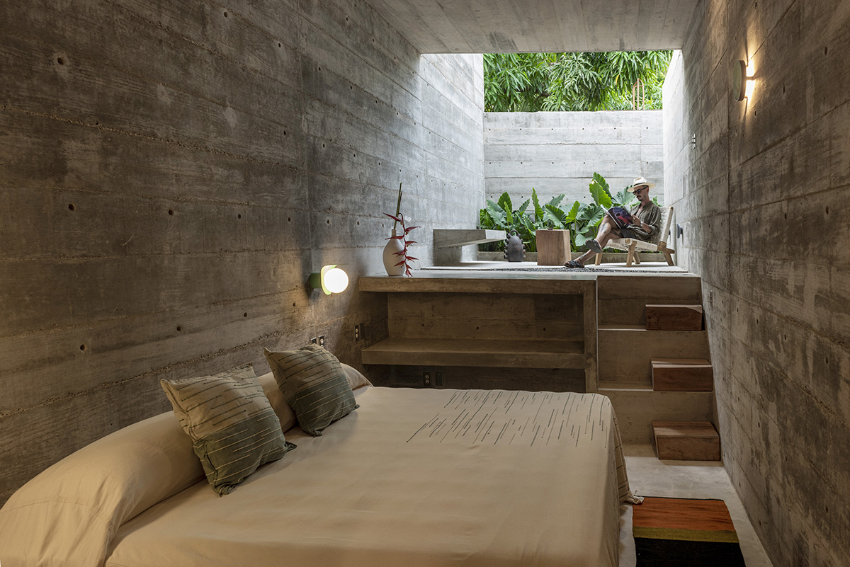 Casa TO by Ludwig Godefroy features an island of stairs and vaulted volumes to create discreet oasis