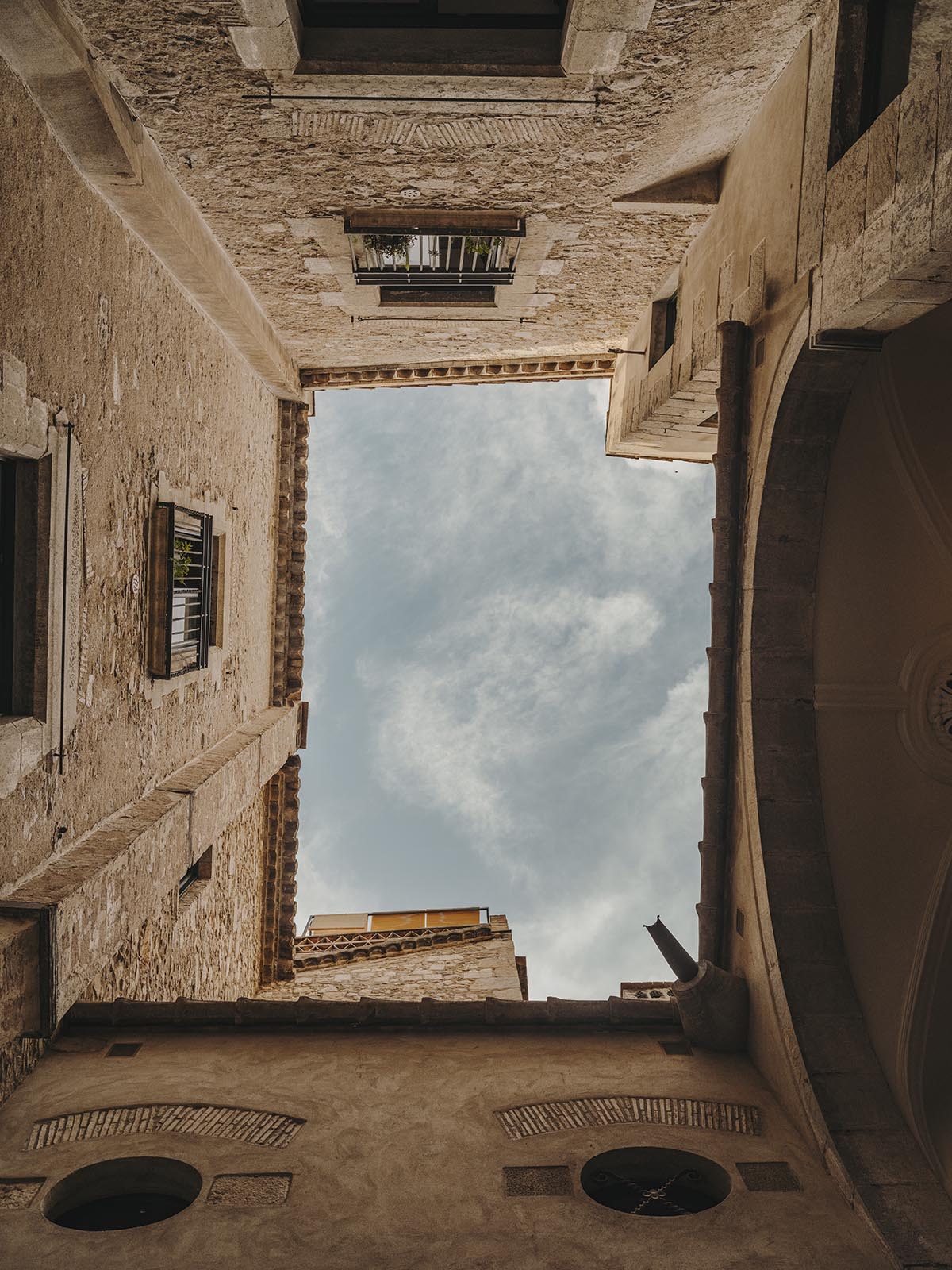 El Equipo Creativo converts 18th-century palace into hotel with rich textures and colors in Girona