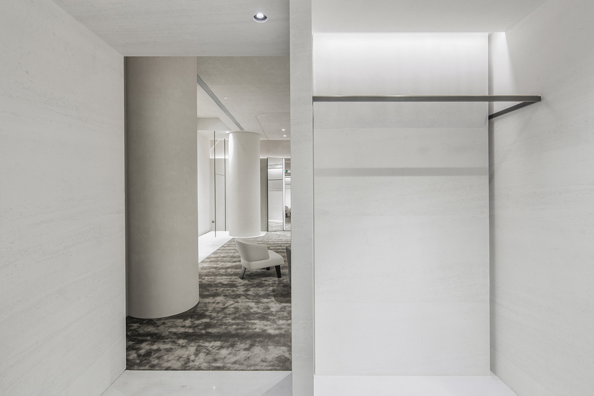 Atelier tao+c combines bright interior with black-framed showcase rooms for flagship store in China