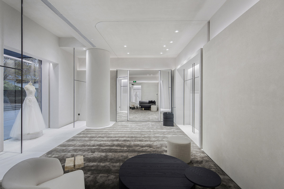 Atelier tao+c combines bright interior with black-framed showcase rooms for flagship store in China