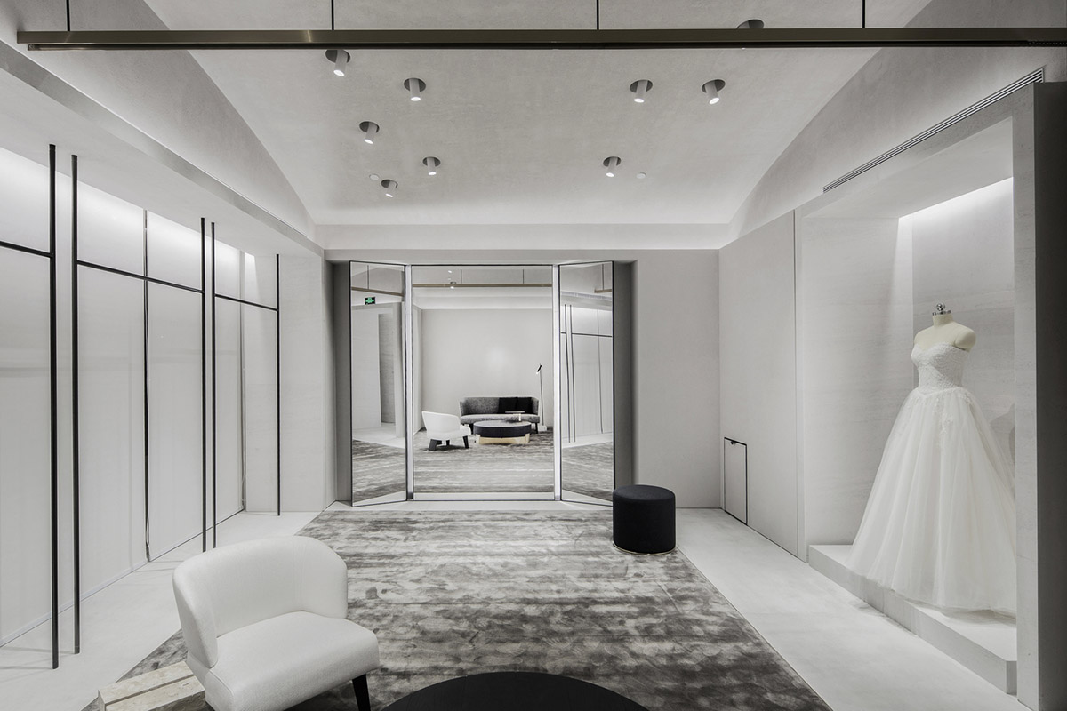 Atelier tao+c combines bright interior with black-framed showcase rooms for flagship store in China