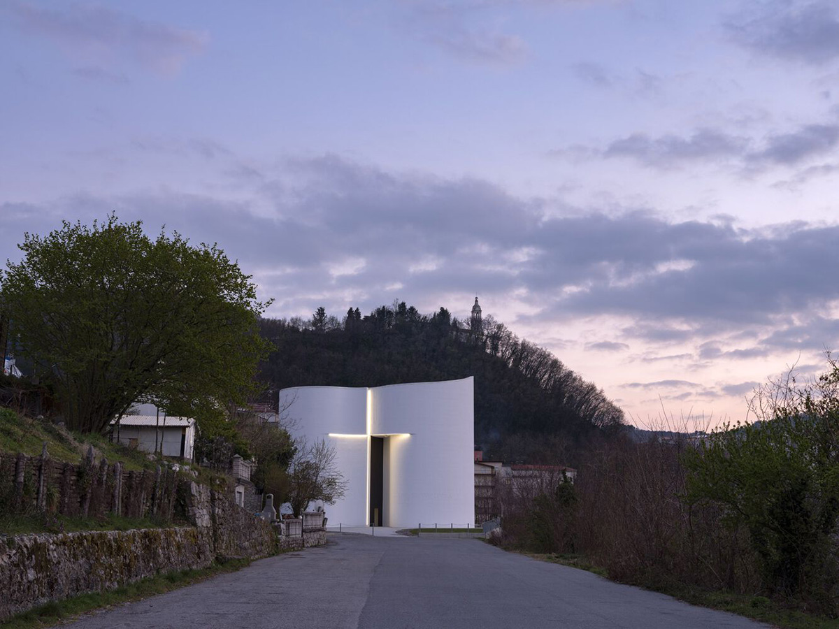 Smooth all-white walls form church designed by Mario Cucinella Architects in Mormanno hill town 