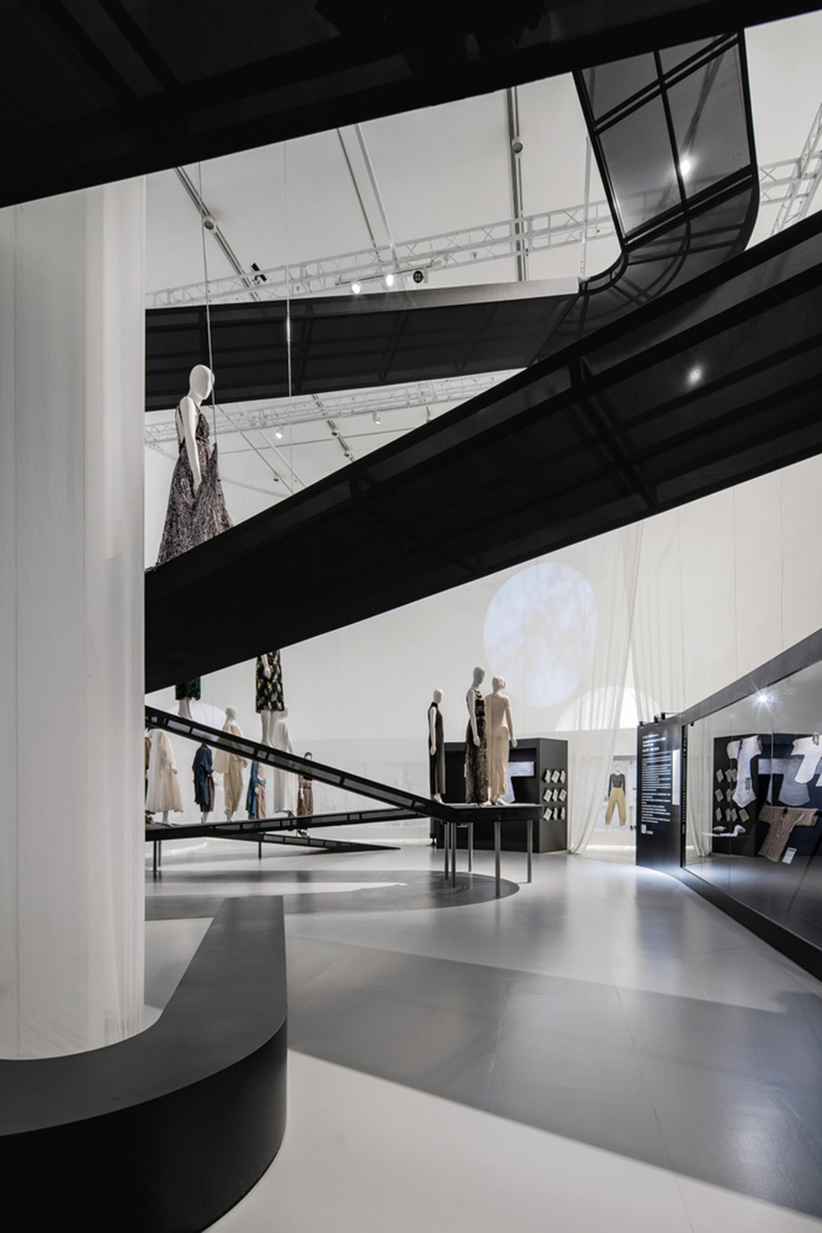 Studio 10 designs exhibition space with white tubular structures and black translucent ramps in China