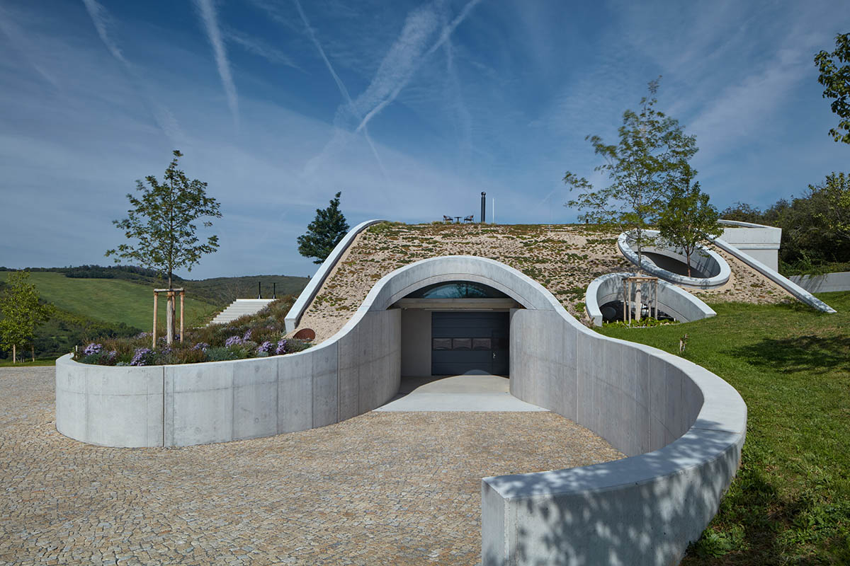 Curved green roof hides winery by Aleš Fiala in a rolling landscape in the Czech Republic