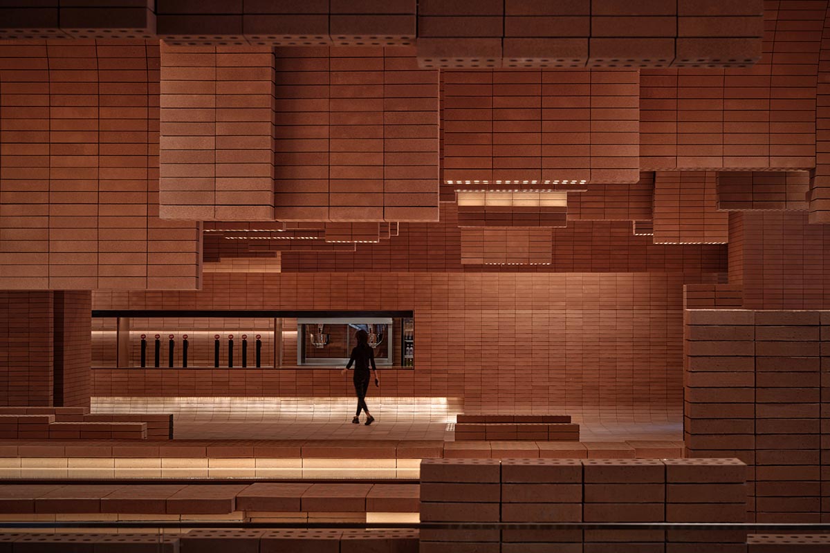 One Plus Partnership adds layered bricks to a cinema interior to resemble waves in Haikou