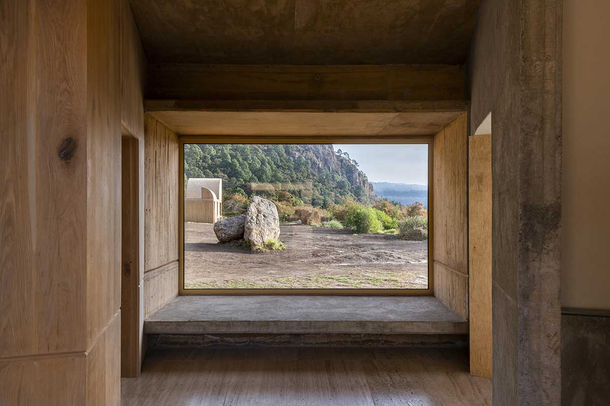 Fernanda Canales creates a circular home framing a mountain and a volcano in Mexico