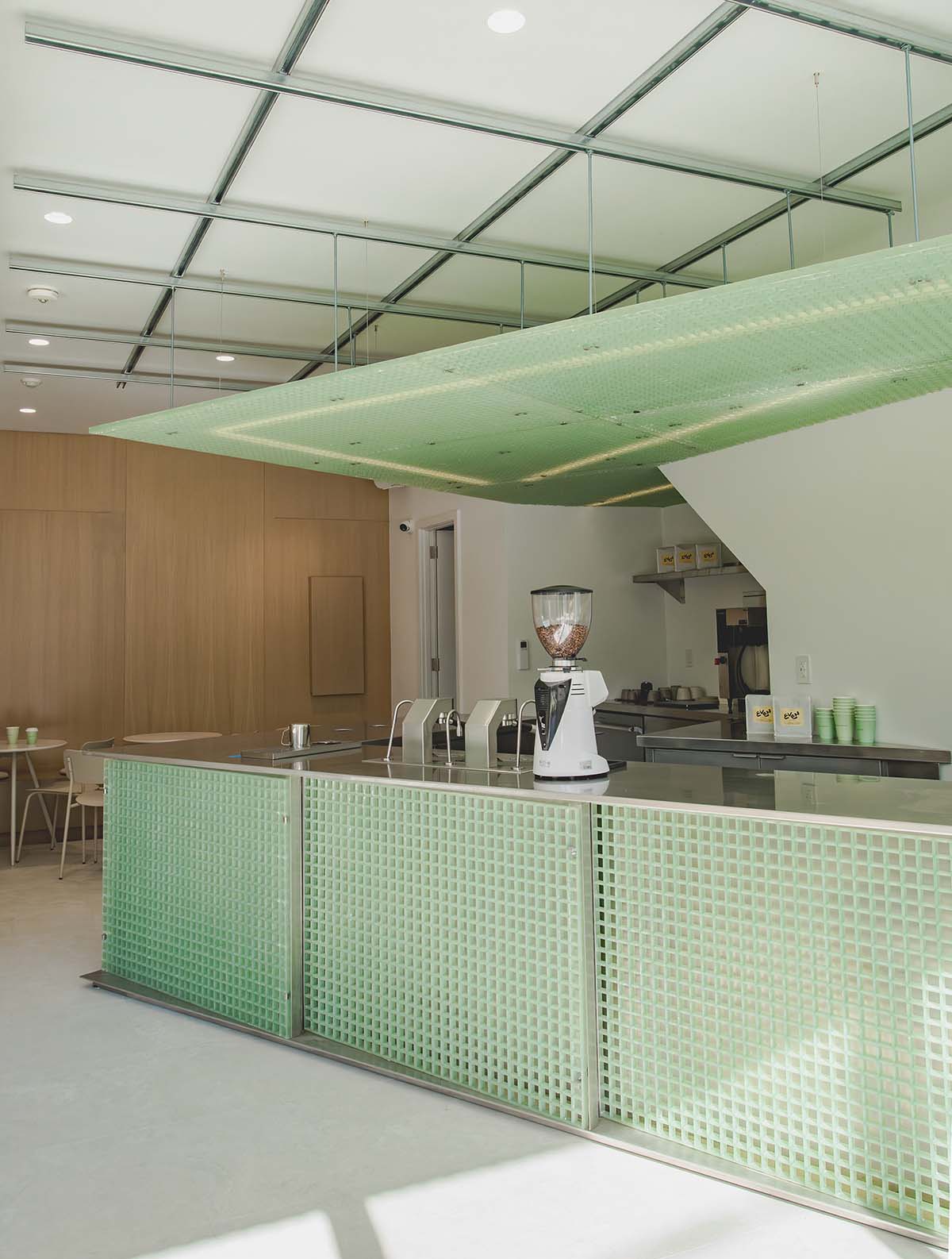 Misc Coffee makes a bold statement with green translucent bar in a busy street of Toronto