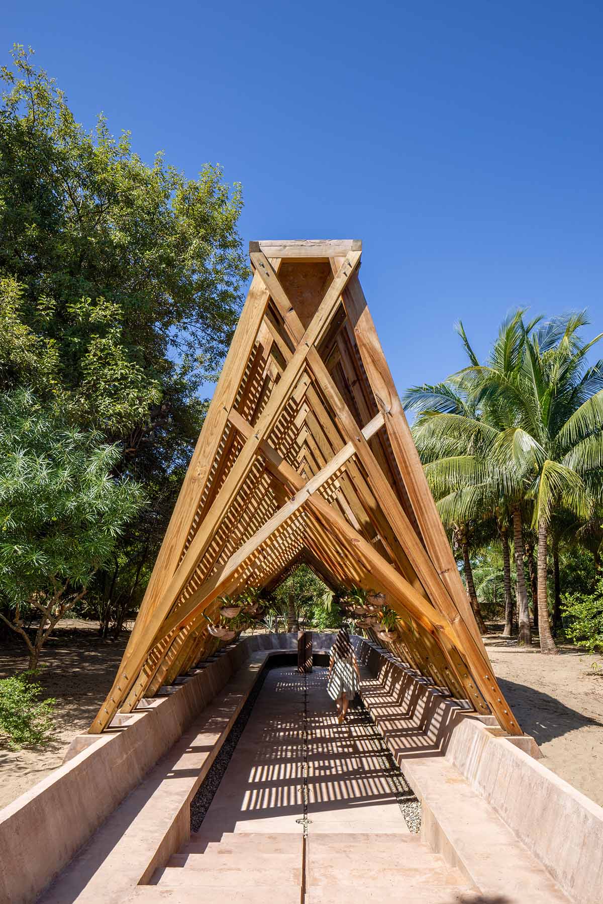 Centro de Colaboración Arquitectónica completes wooden Orchid Pavilion for Casa Wabi in Mexico