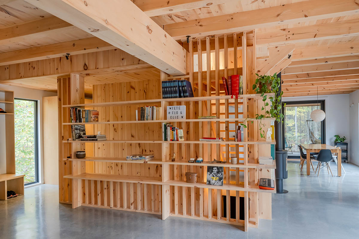 Country home is a wooden shelter that brings tranquility in the heart of the forest in Canada