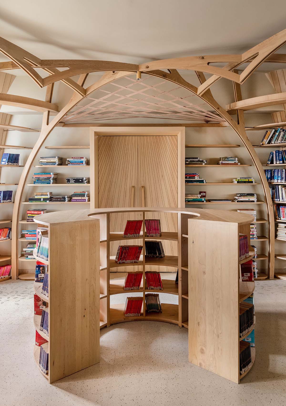studio Hinge embeds a library under the wooden tree-like canopies in Mumbai