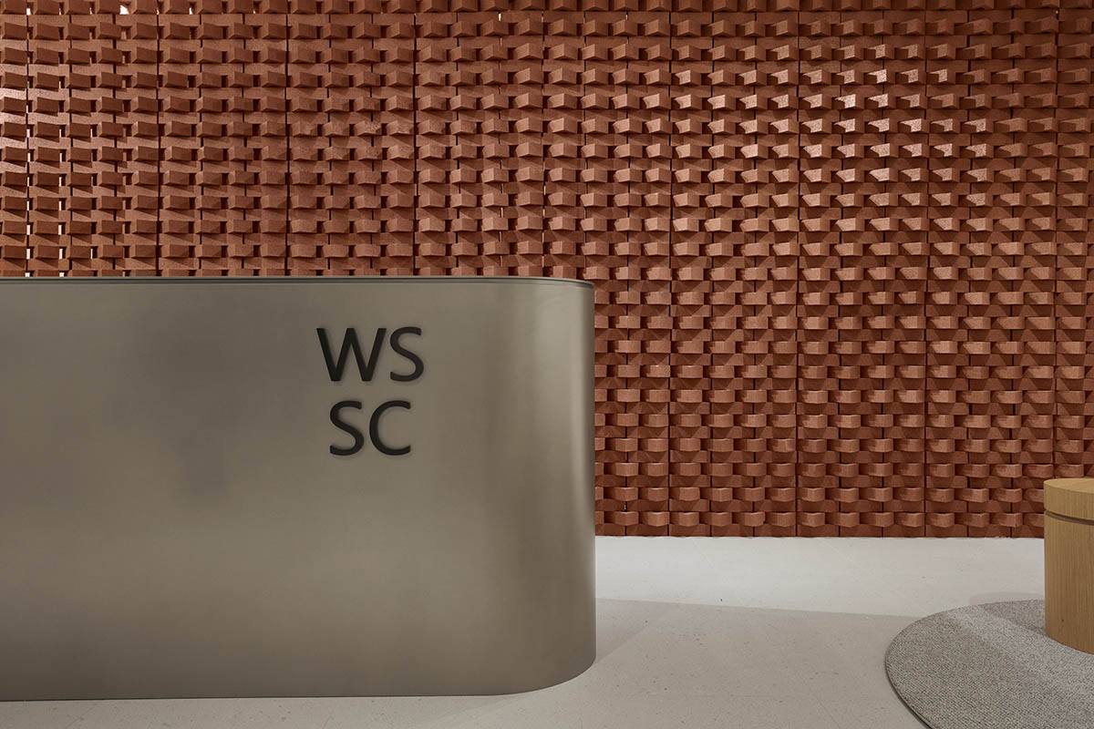 Surgical center features artisanal terracotta brick wall to reverse 