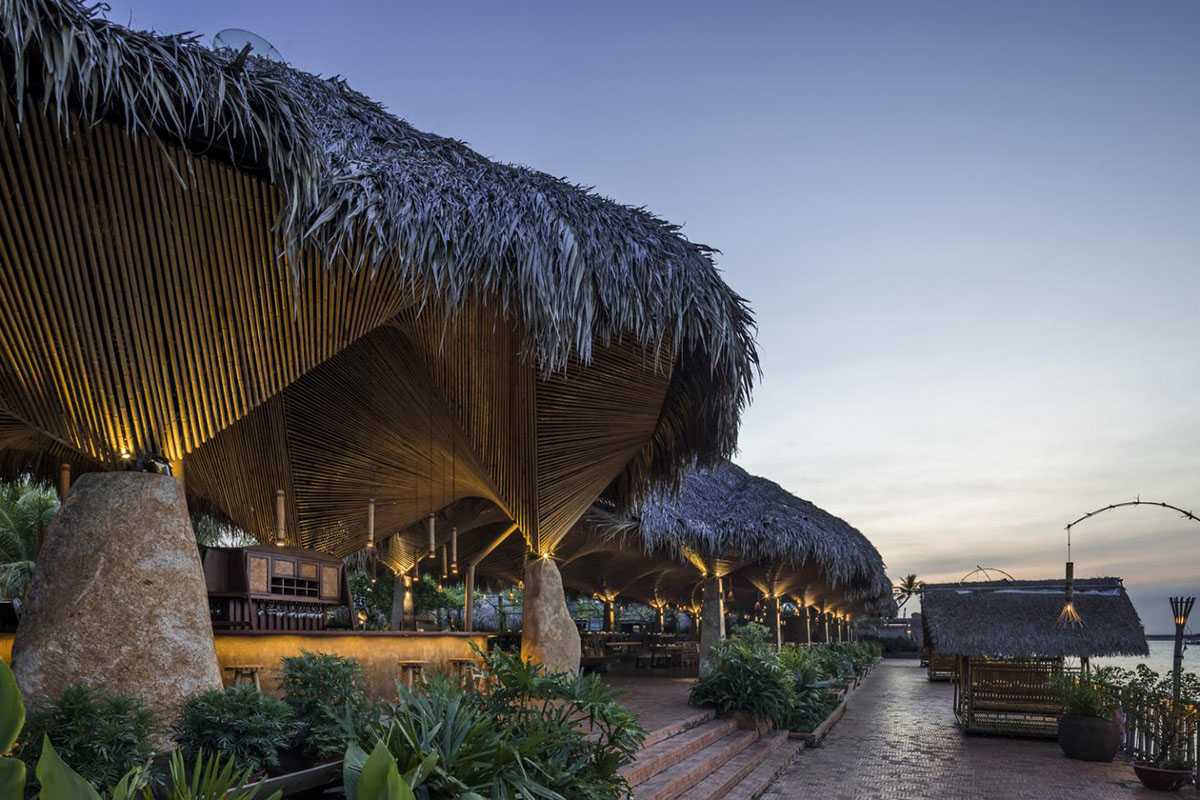 DDconcept Architecture uses coconut leaves and bamboo to create undulating restaurant in Vietnam