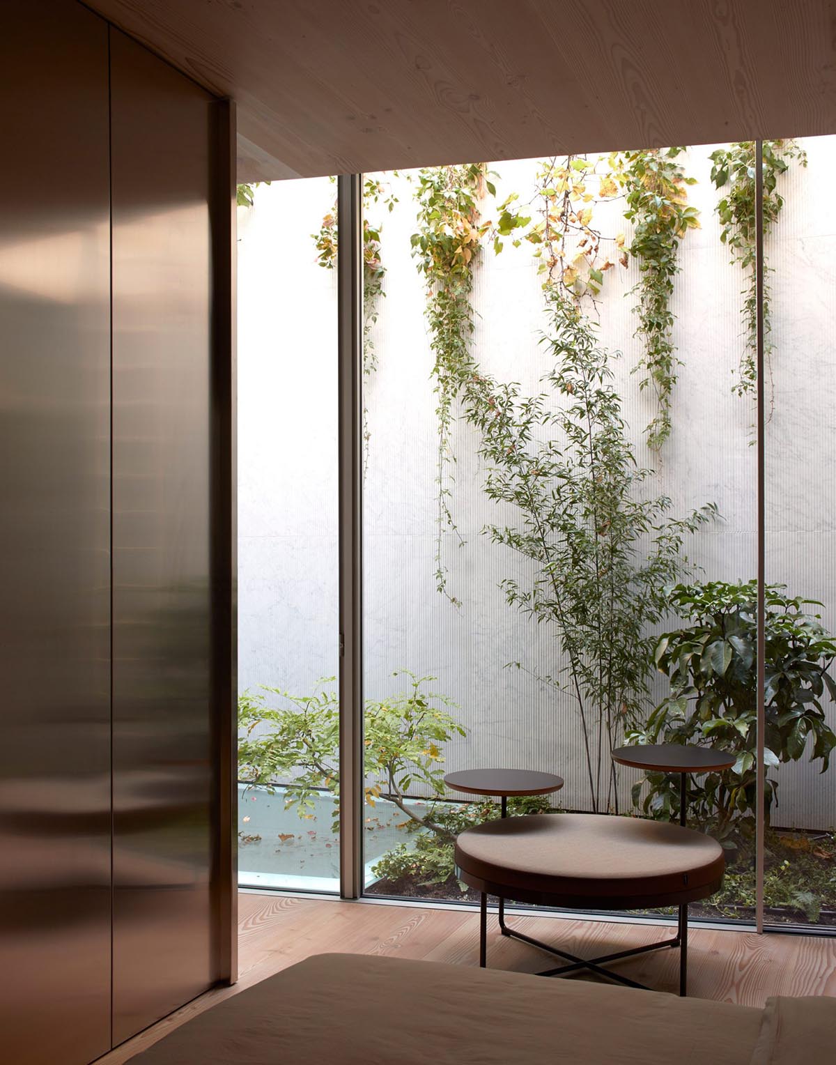 Gianni Botsford Architects transforms dilapidated bungalow with a giant copper clad roof in London