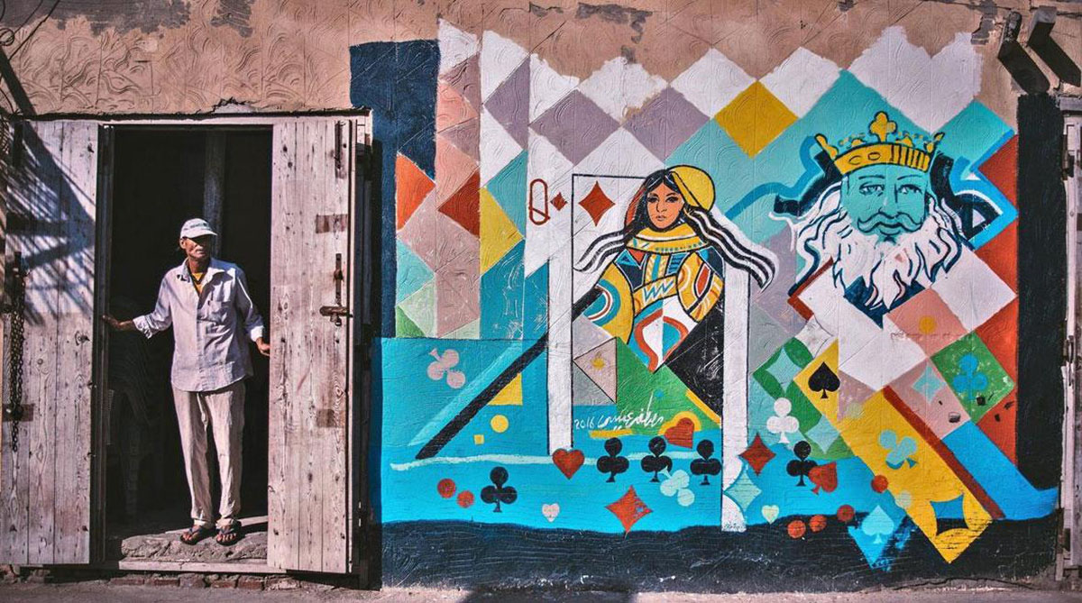 Mona Hassan captures Egyptian Village Festival Houses composed of colourful paintings by 40 artists