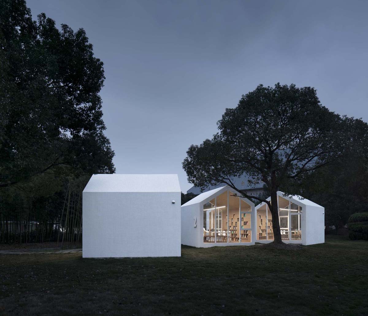 Four mini cabins by Yuan Architects scattered in a forest to create a reading village in Taizhou City
