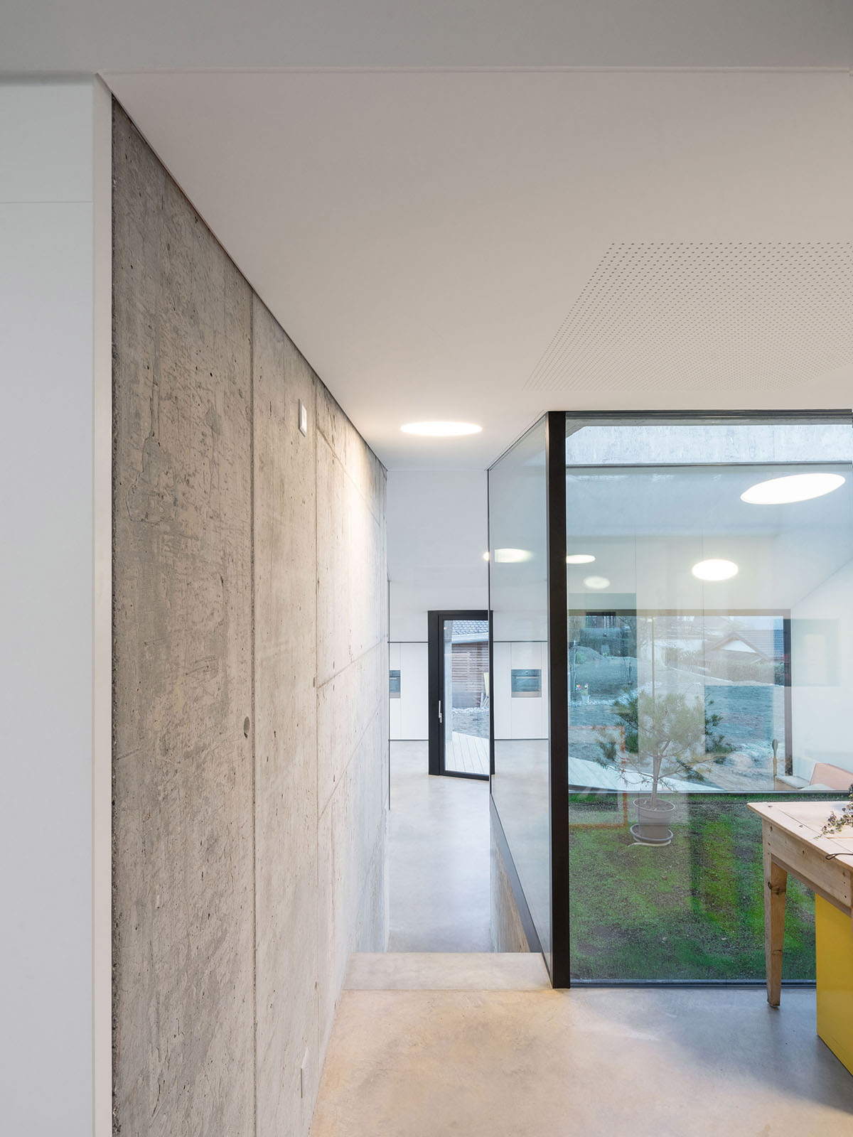 Anako Architecture completes slopped concrete residence in Switzerland