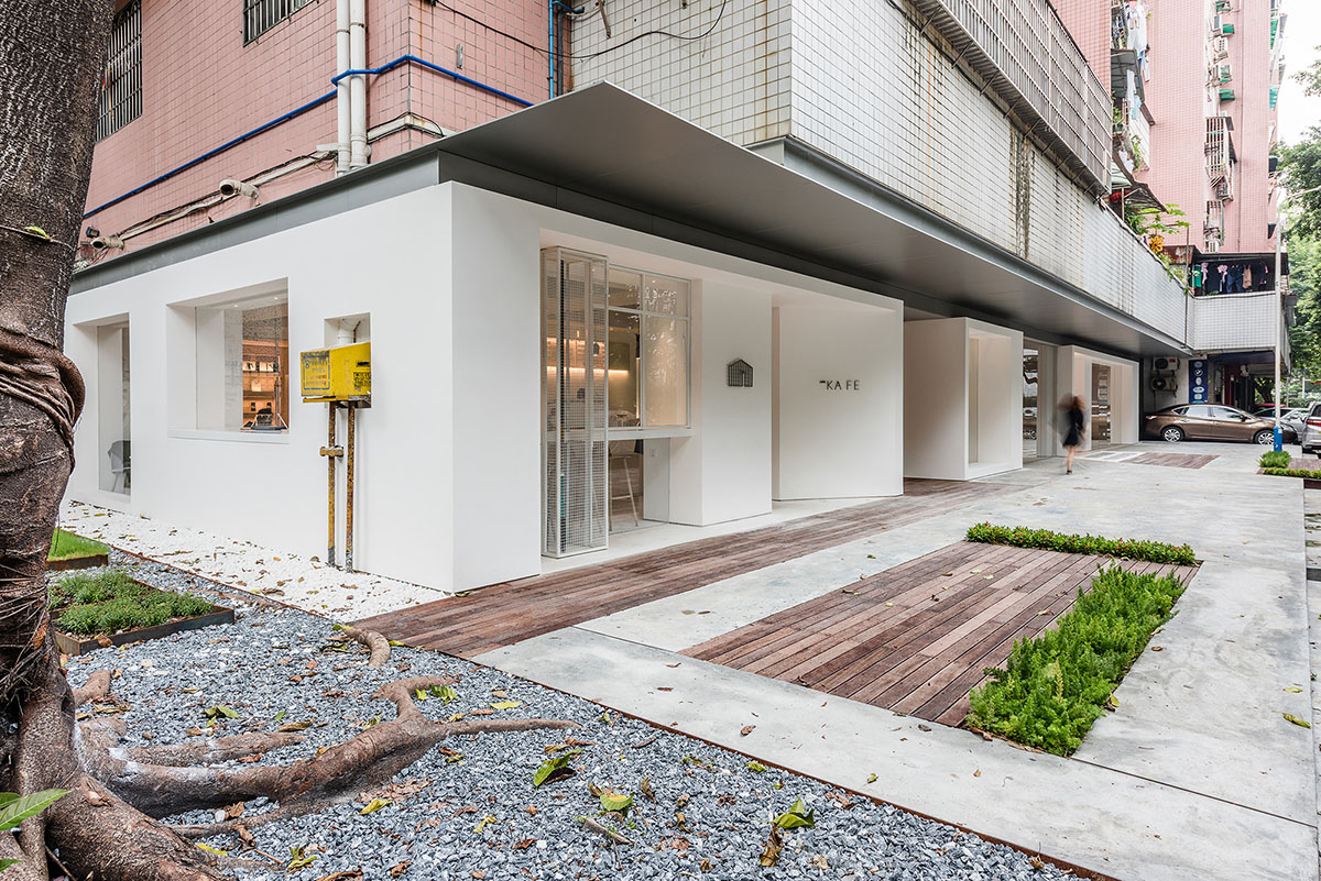 Lukstudio plays with cut-out volumes to transform old Chinese building into cafe and office