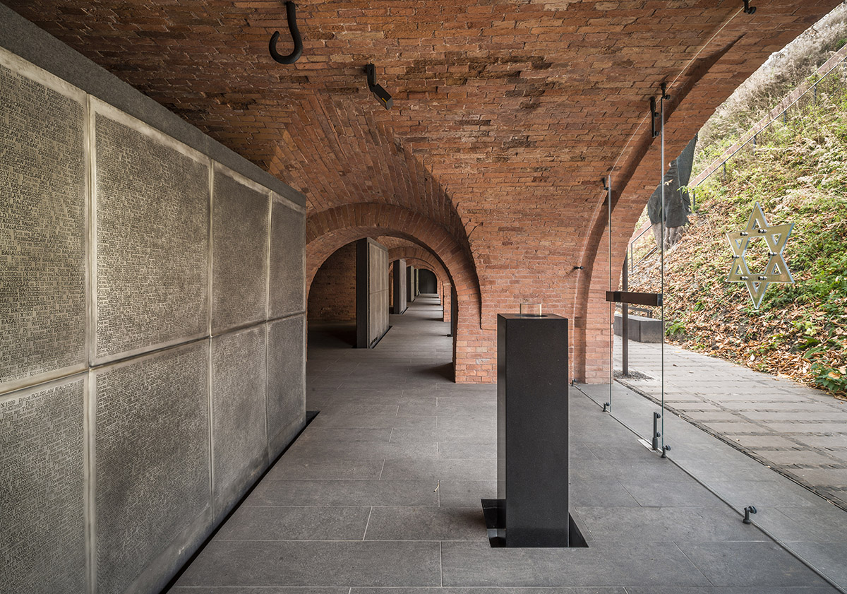 BBGK Architekci designed 12-metre-high stained concrete wall to narrate victims for Katyn Museum