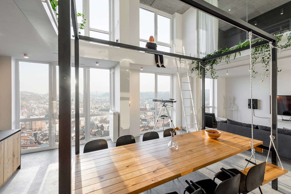 Metal framed-table, glass partitions, green infills make this interior space vivid and light in Lviv