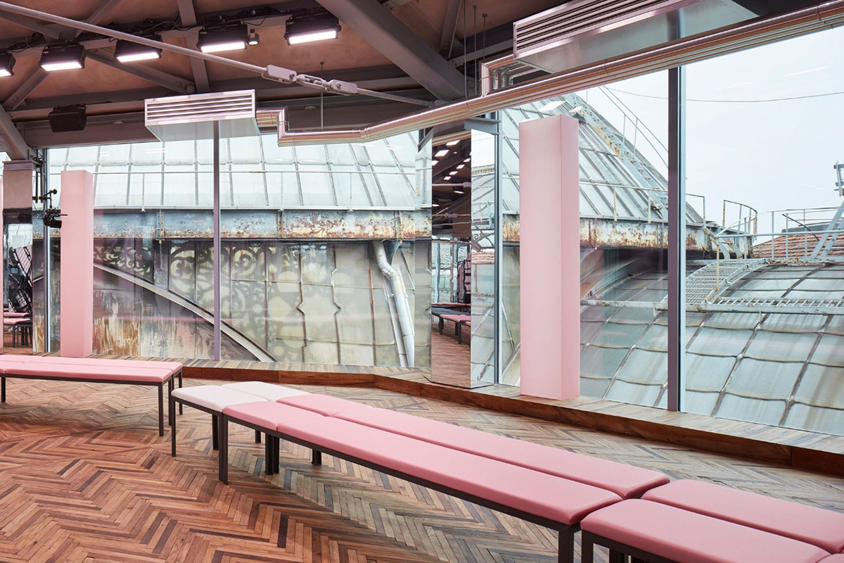 AMO filled Prada 2018 Resort stage with pink columns, continuous mirrors and disoriented seatings