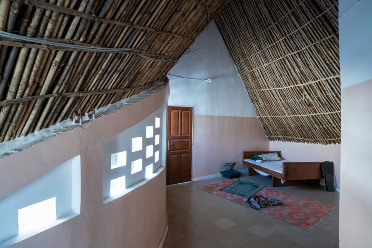 Toshiko Mori built Fass School and Teachers’ Residence featuring wavy thatched roof in remote Senegal