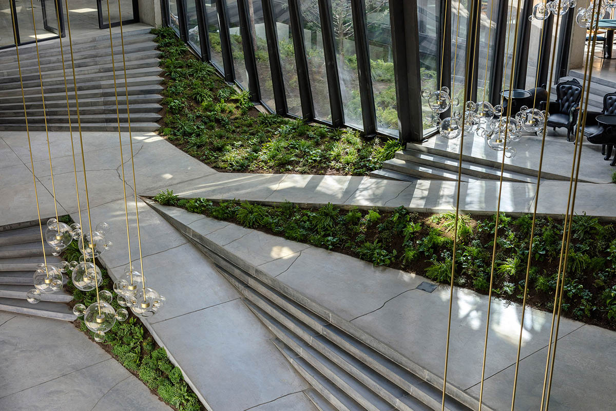 Folded concrete shell wraps coffee production plant by Giorgi Khmaladze Architects in Tbilisi