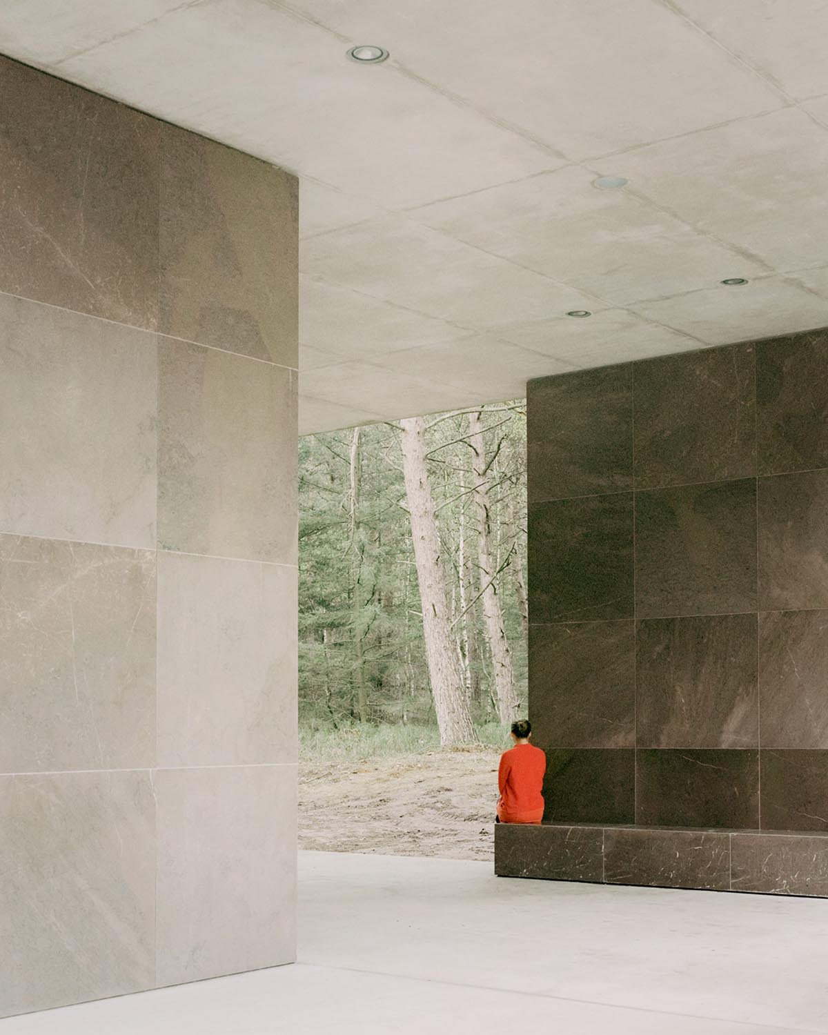 KAAN Architecten built serene Loenen Pavilion commemorating Dutch victims among pine trees